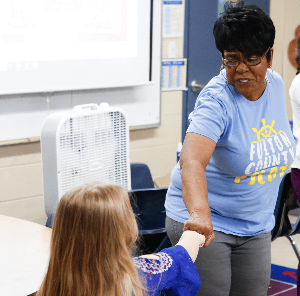 Educator supporting a student.